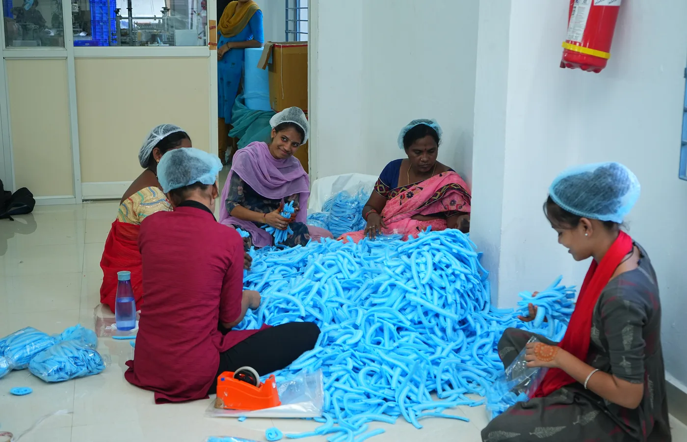 Devishree team sorting blue disposable stock at the Hyderabad unit