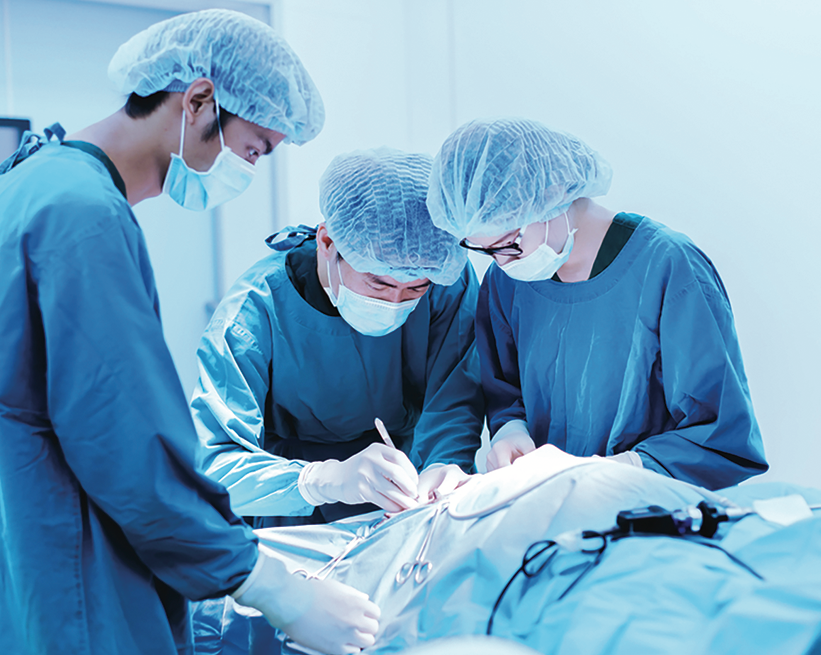 Medical team using protective disposable equipment